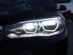 2014 BMW X5 xDrive 35i Sparking Brown Metallic front led headlights on